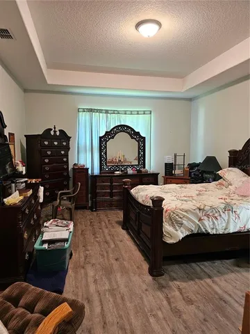 a bed room with a bed and a television