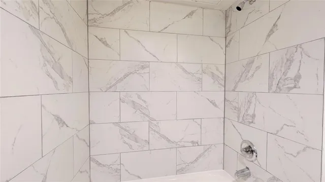 a view of a house with yard and tree s