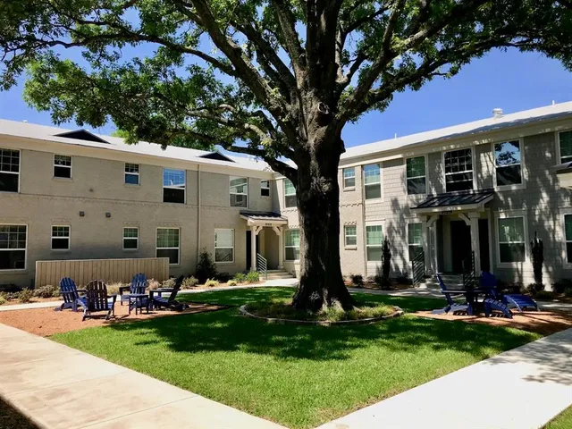 a front view of house with yard and outdoor seating