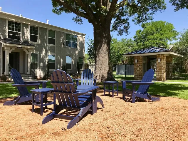 a front view of a house with garden and porch