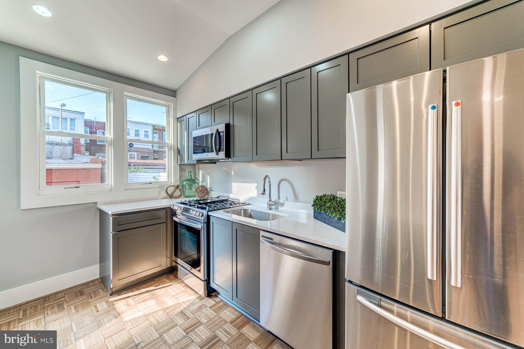 117 R Street Northwest Washington, DC 20001 - Photo 14 of 45 Quartz countertops and Samsung appliances