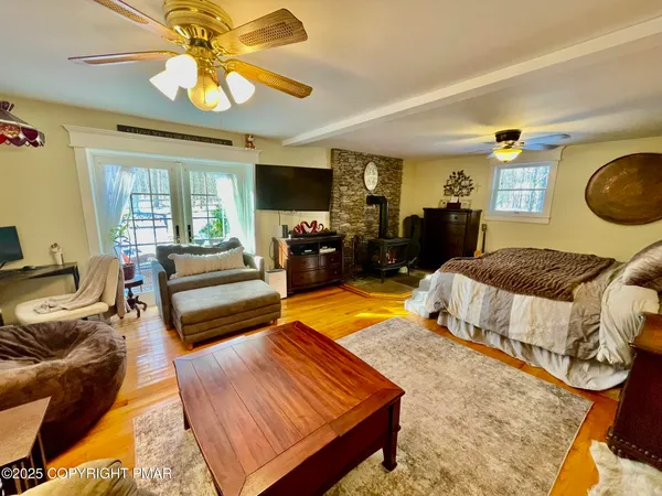 a bedroom with a bed and couch