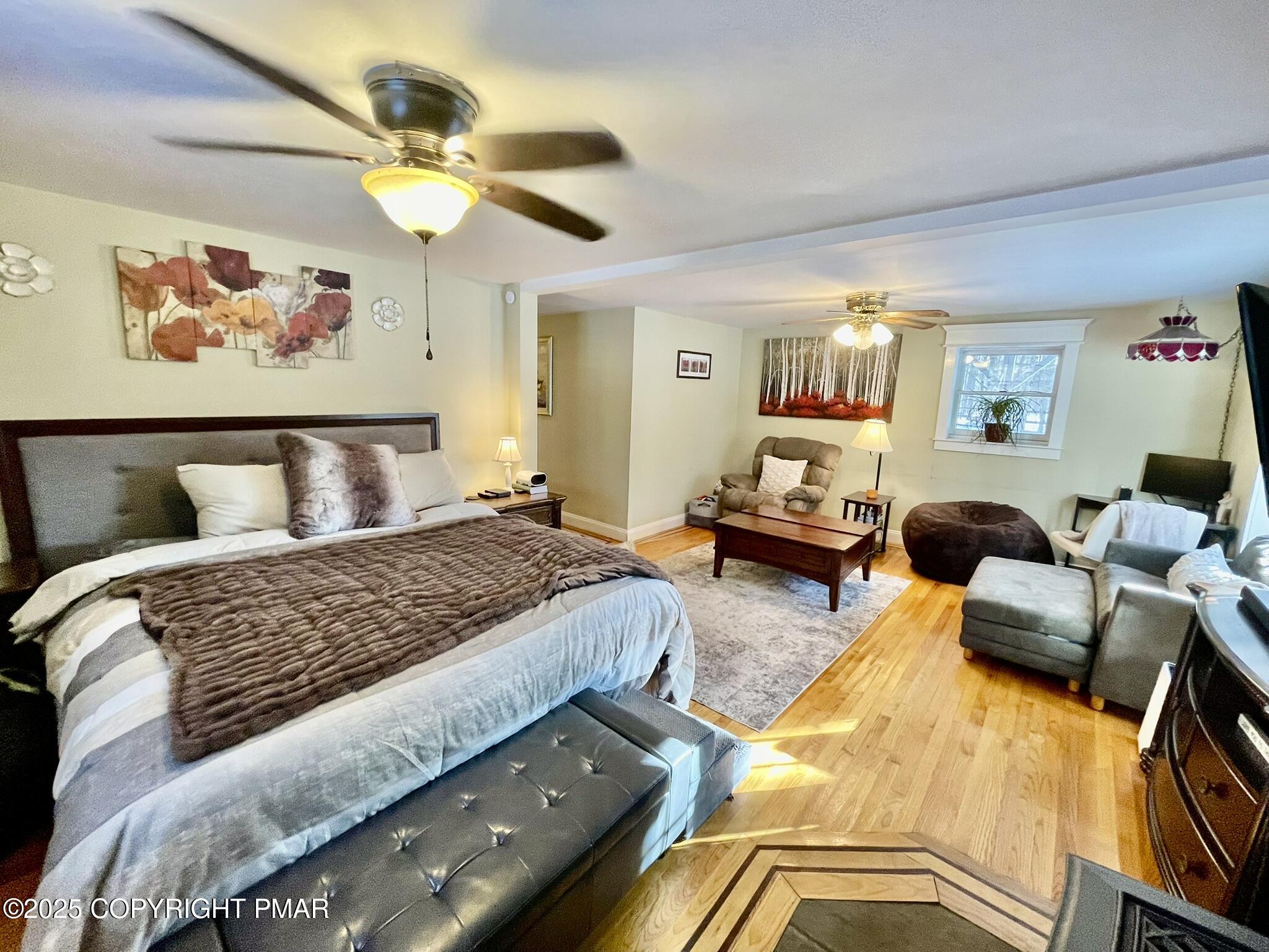 73 Panther Run Road Jim Thorpe, PA 18229 - Photo 14 of 55 a bedroom with a bed and wooden floor