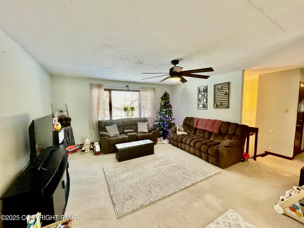 a bedroom with furniture and a chandelier
