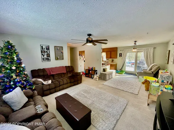 a bedroom with furniture and a flat screen tv