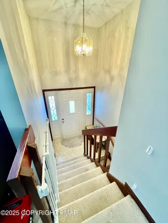 a bedroom with bed and a window