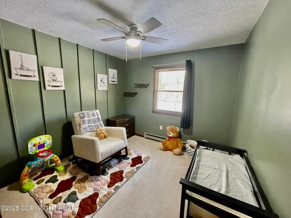 a bedroom with furniture and a wooden floor