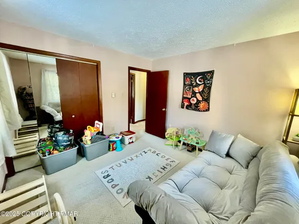 a bathroom with a shower curtain and a sink