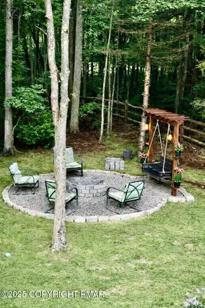 a backyard of a house with outdoor seating