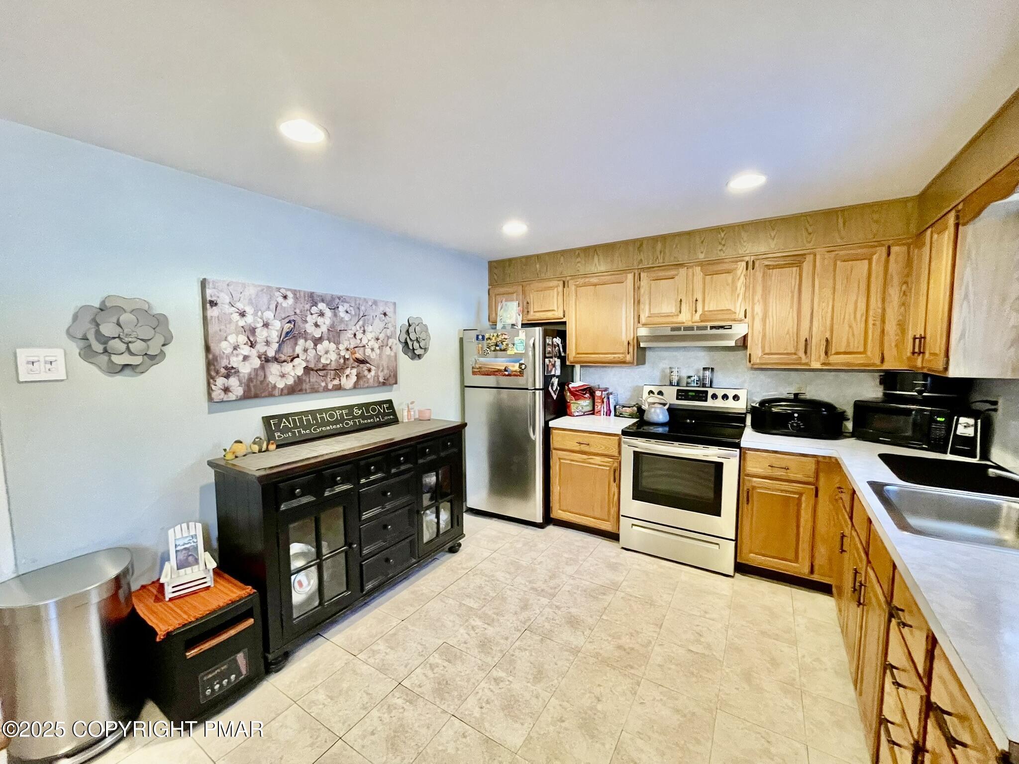 73 Panther Run Road Jim Thorpe, PA 18229 - Photo 7 of 55 a kitchen with stainless steel appliances a stove top oven a sink dishwasher and a refrigerator
