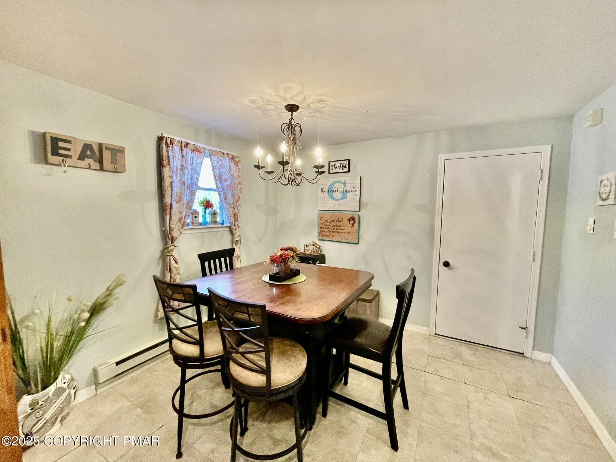 73 Panther Run Road Jim Thorpe, PA 18229 - Photo 8 of 55 a view of a dining room with furniture and chandelier