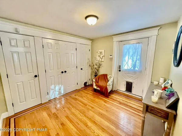 a bedroom with furniture and a flat screen tv