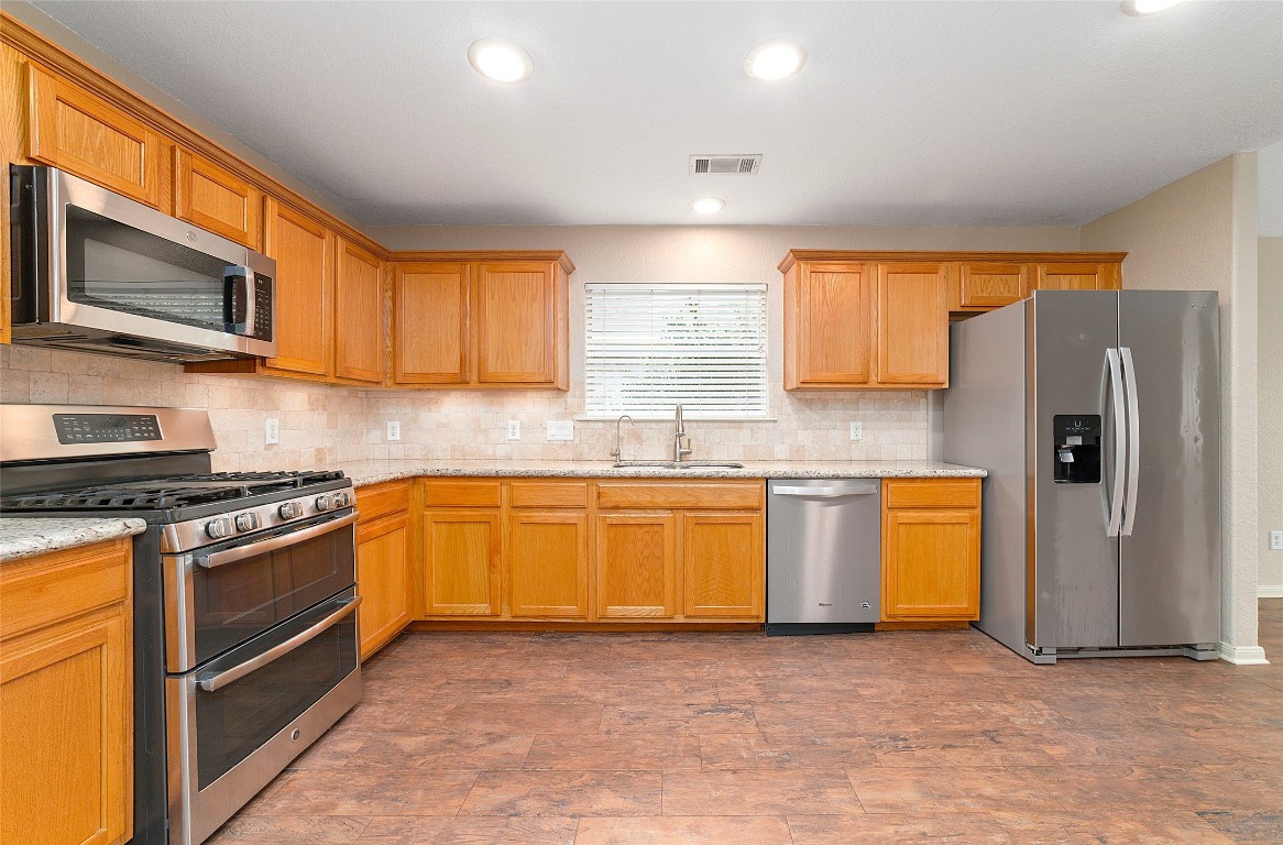 14610 Hazy Ridge Lane Cypress, TX 77429 - Photo 13 of 38 Kitchen has upgraded stainless appliances