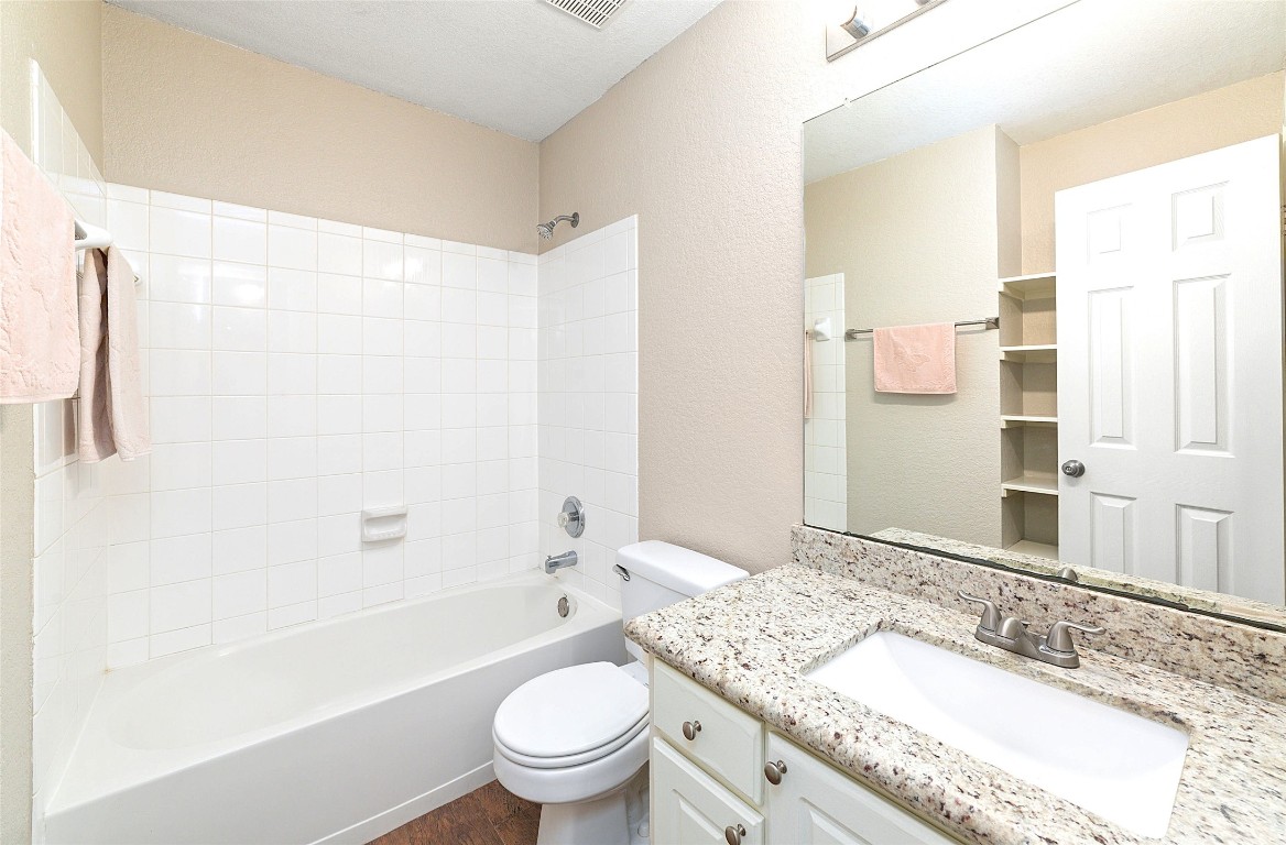 14610 Hazy Ridge Lane Cypress, TX 77429 - Photo 25 of 38 Guest bathroom with pretty granite counter and built-in shelving