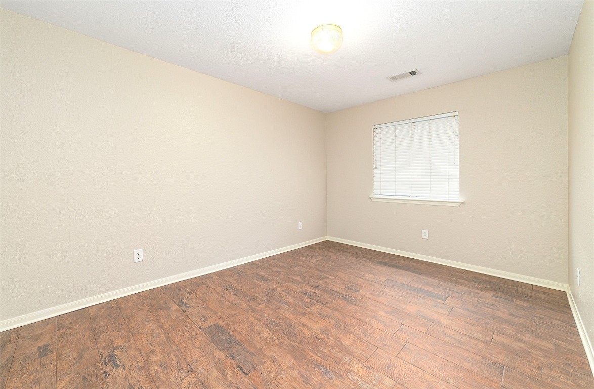 14610 Hazy Ridge Lane Cypress, TX 77429 - Photo 27 of 38 BR #3; tile flooring, walk-in closet