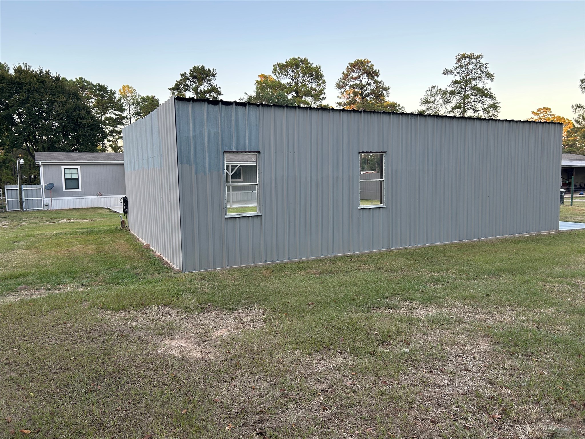 19007 Turtle Creek Way Magnolia, TX 77355 - Photo 12 of 34 a backyard of a house with lots of green space and plants