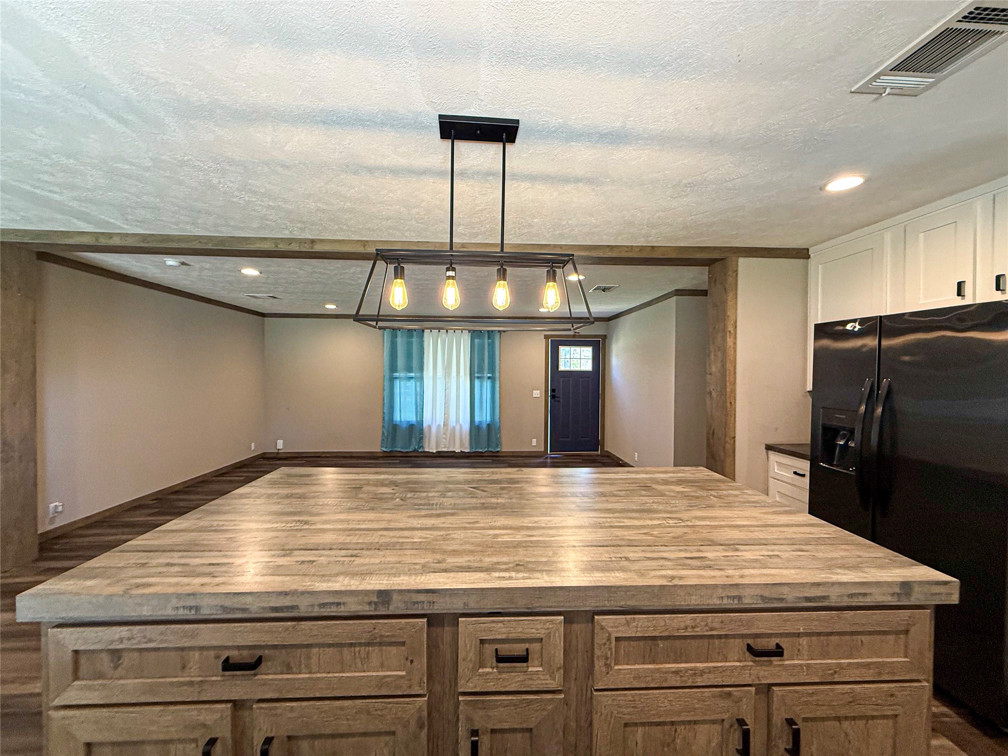 19007 Turtle Creek Way Magnolia, TX 77355 - Photo 4 of 34 a view of a refrigerator counter space and wooden floor