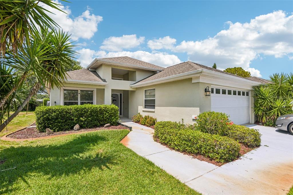 1129 Daleside Lane New Port Richey, FL 34655 - Photo 2 of 34 a front view of a house with a yard
