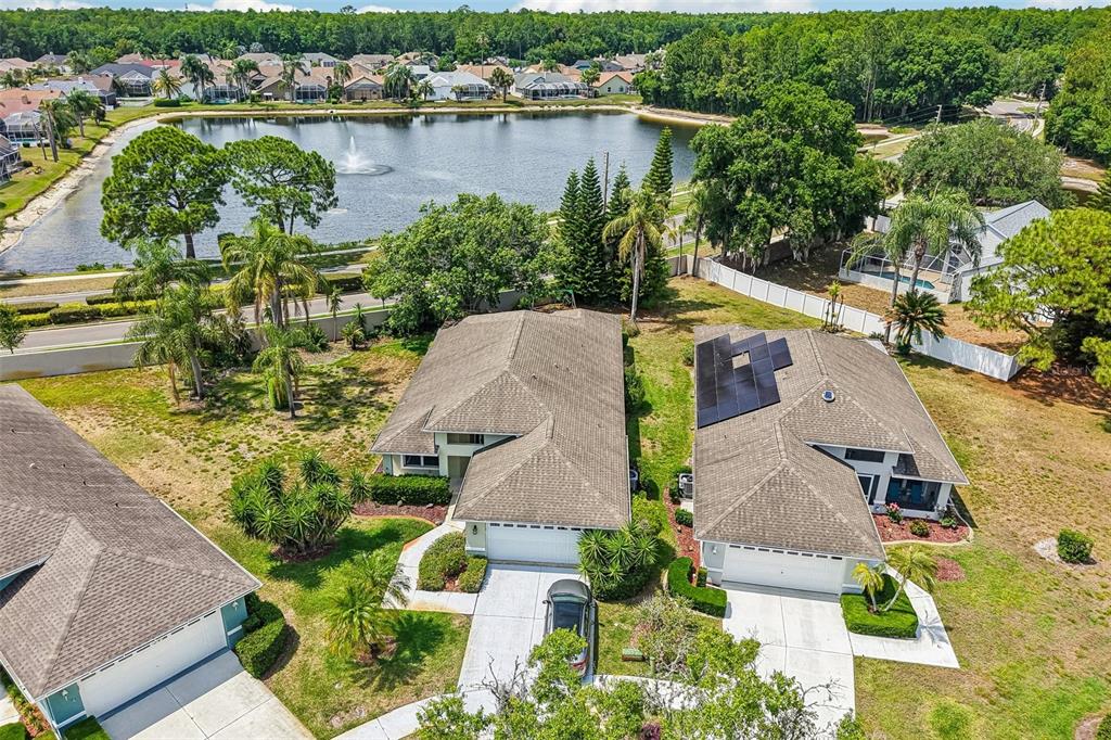 1129 Daleside Lane New Port Richey, FL 34655 - Photo 29 of 34 an aerial view of a house with a lake view