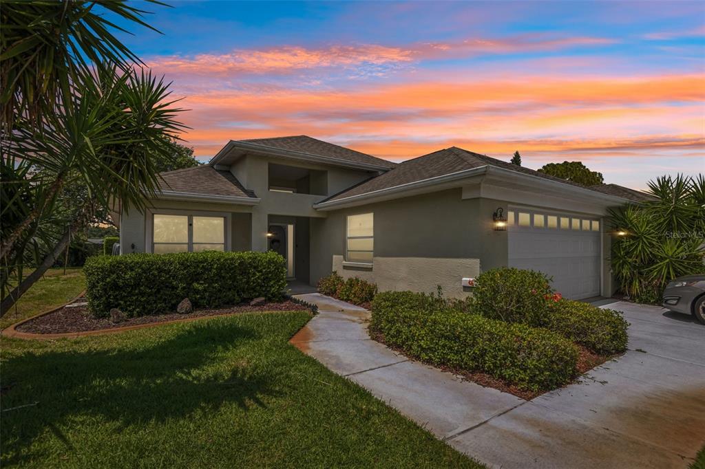 1129 Daleside Lane New Port Richey, FL 34655 - Photo 30 of 34 a front view of a house with a yard