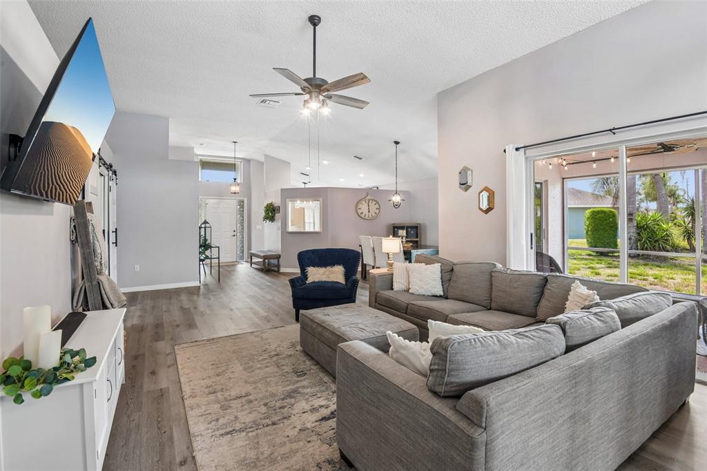 1129 Daleside Lane New Port Richey, FL 34655 - Photo 5 of 34 a living room with furniture and a large window