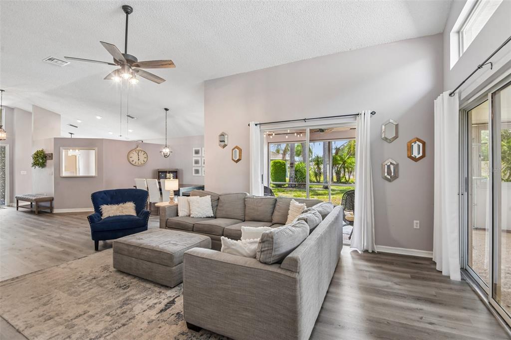 1129 Daleside Lane New Port Richey, FL 34655 - Photo 7 of 34 a living room with furniture and a large window
