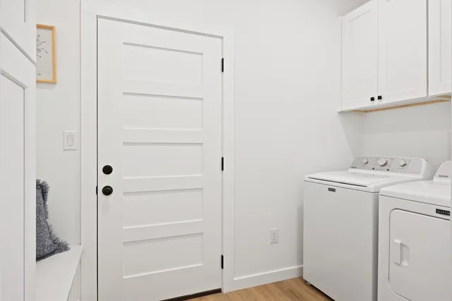 a view of storage and utility room with closet