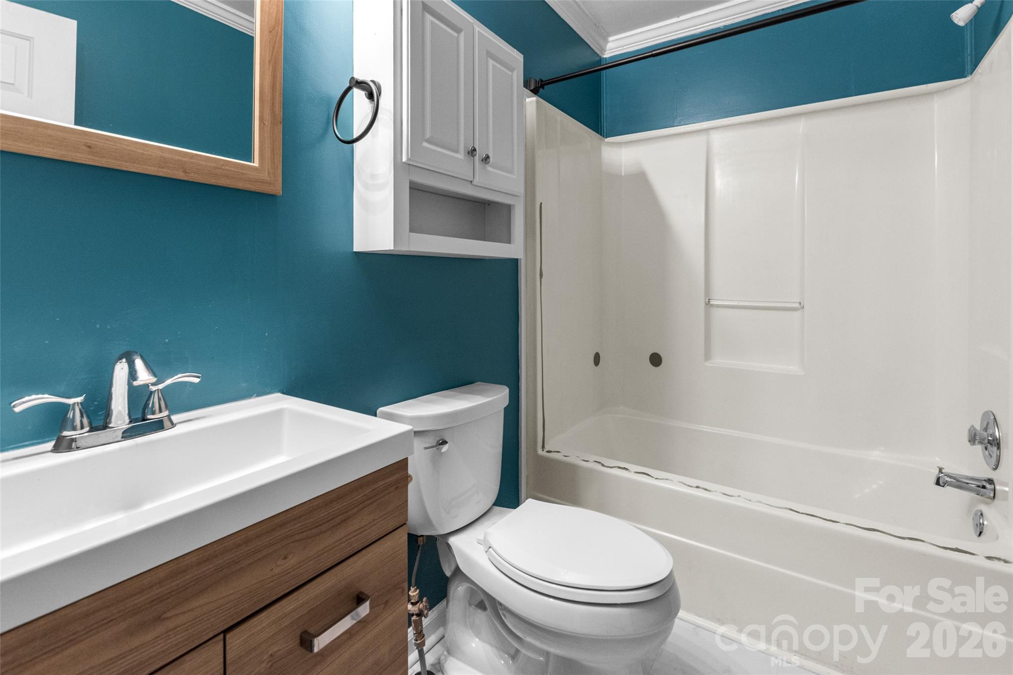 434 Rutledge Drive Catawba, SC 29704 - Photo 31 of 39 a bathroom with a sink a toilet and shower