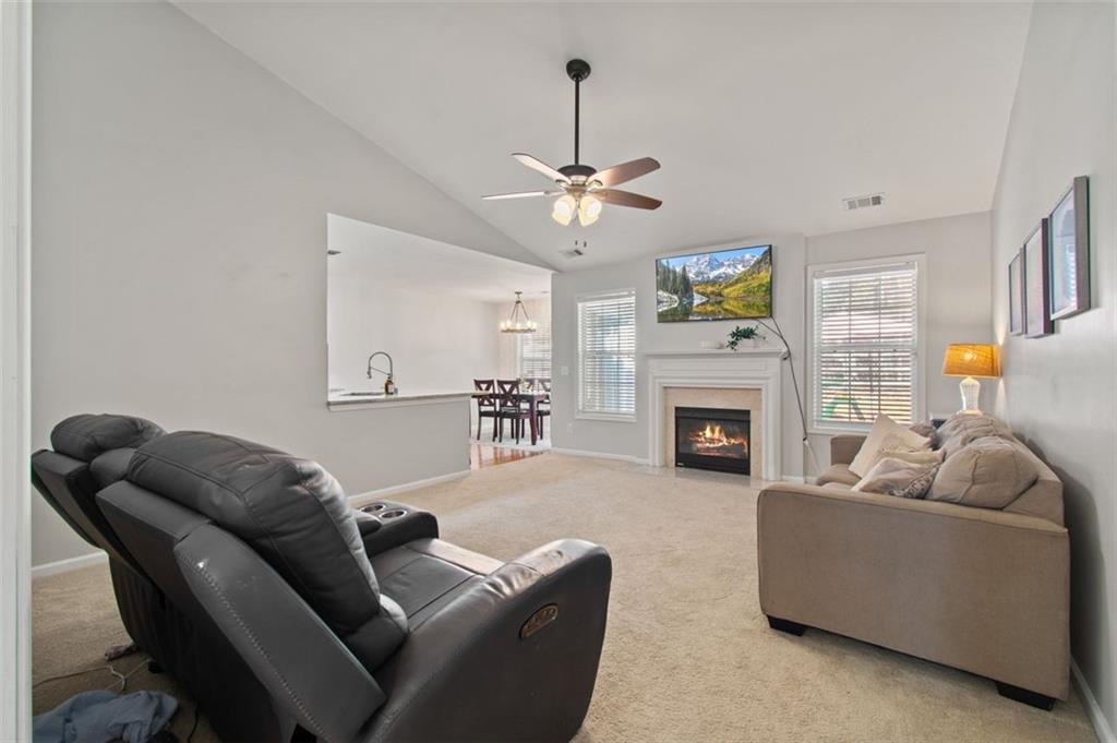 2907 Albright Commons Kennesaw, GA 30144 - Photo 17 of 35 a living room with furniture a window and a fireplace