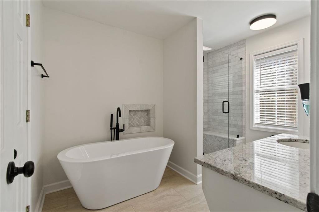 2907 Albright Commons Kennesaw, GA 30144 - Photo 20 of 35 a bathroom with a granite countertop sink and a mirror