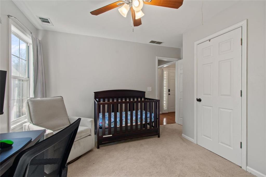 2907 Albright Commons Kennesaw, GA 30144 - Photo 24 of 35 a bedroom with furniture and window