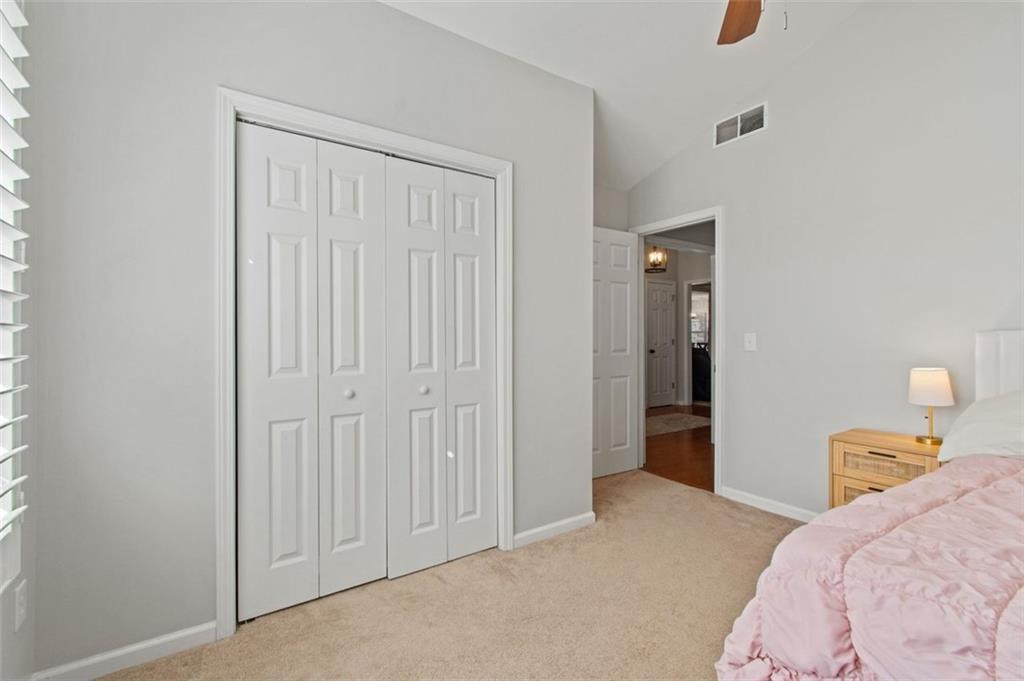 2907 Albright Commons Kennesaw, GA 30144 - Photo 27 of 35 a bedroom with a bed and cabinets
