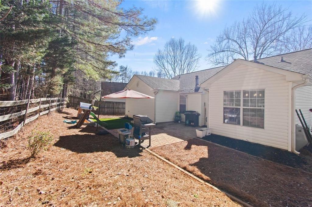 2907 Albright Commons Kennesaw, GA 30144 - Photo 32 of 35 a front view of a house with a yard covered in snow