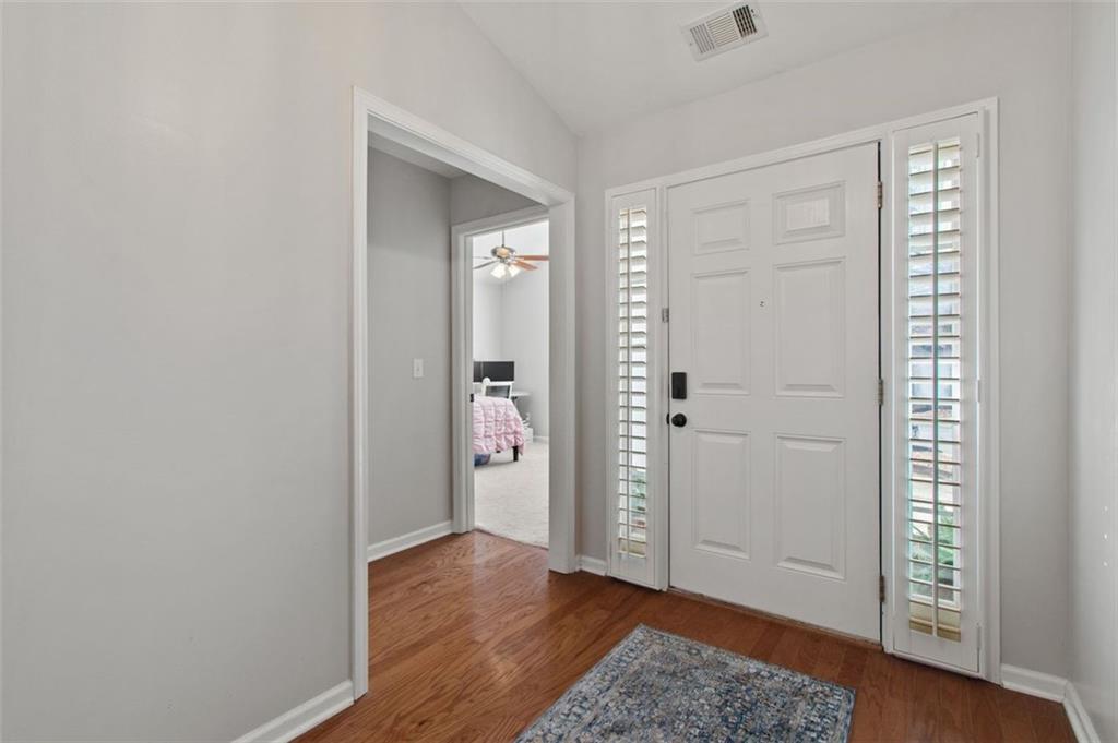 2907 Albright Commons Kennesaw, GA 30144 - Photo 5 of 35 an empty room with wooden floor closet and windows