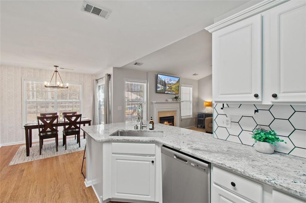 2907 Albright Commons Kennesaw, GA 30144 - Photo 6 of 35 a kitchen with white cabinets and sink