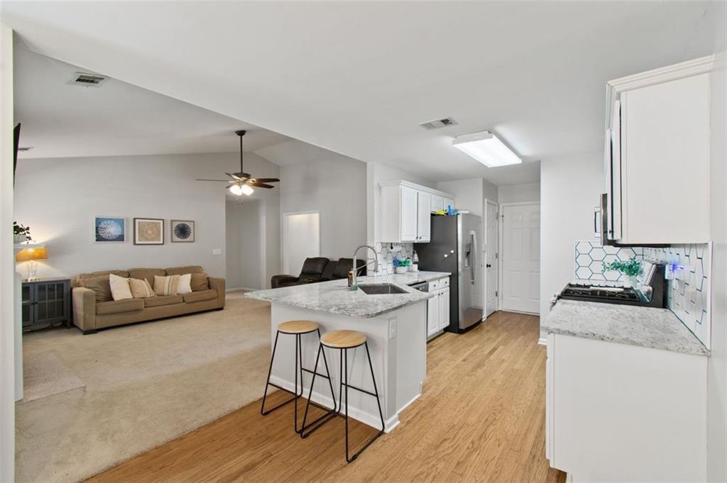 2907 Albright Commons Kennesaw, GA 30144 - Photo 8 of 35 a view of a living room and kitchen