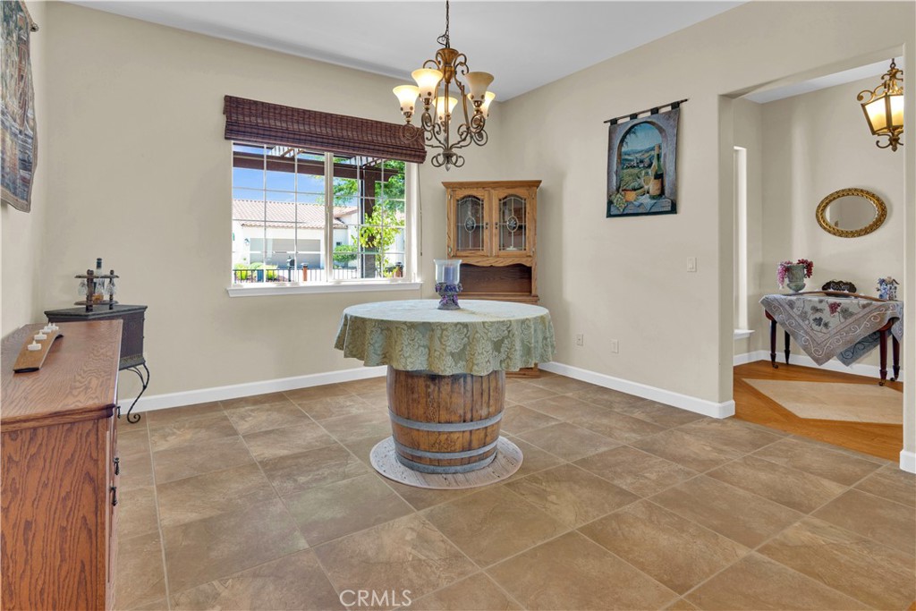 654 Red Cloud Road Paso Robles, CA 93446 - Photo 20 of 46 a dining room with chandelier and window