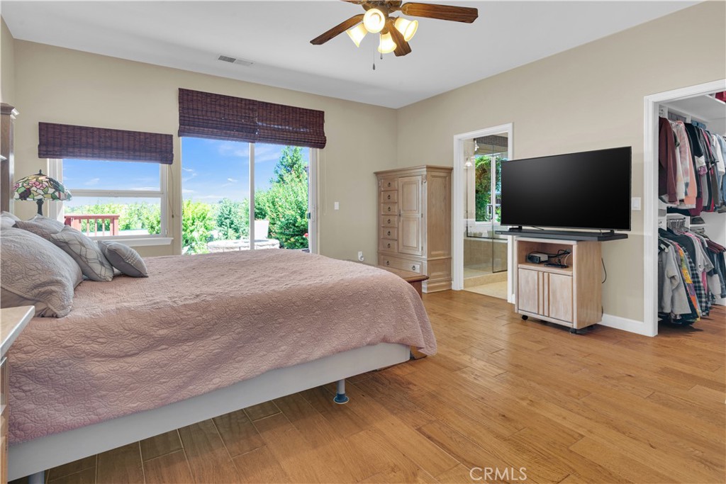 654 Red Cloud Road Paso Robles, CA 93446 - Photo 22 of 46 a bedroom with a bed and a flat screen tv