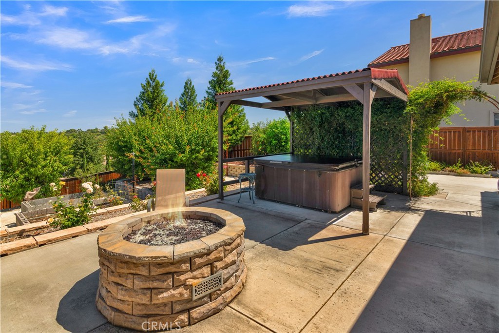 654 Red Cloud Road Paso Robles, CA 93446 - Photo 43 of 46 a view of a patio with table and chairs potted plants with wooden floor