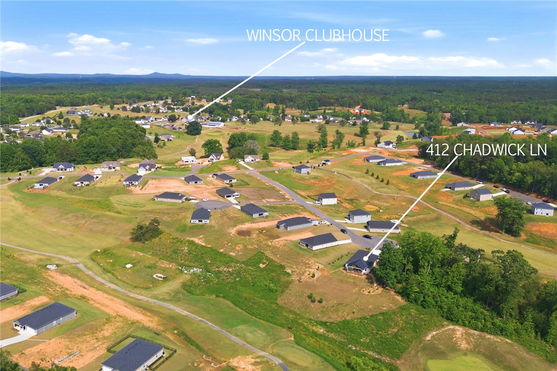 412 Chadwick Lane Walhalla, SC 29691 - Photo 35 of 37 An aerial perspective showcases a residential neighborhood amidst verdant landscapes, highlighting community integration.