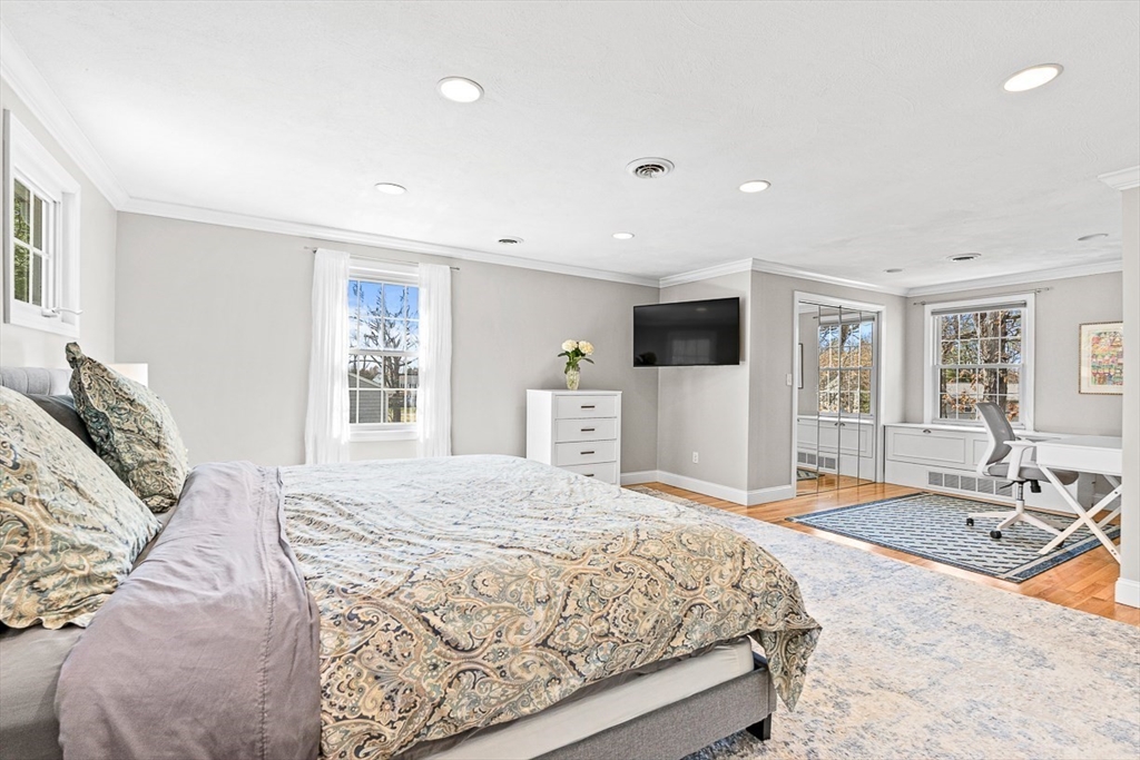 24 Cider Mill Road Framingham, MA 01701 - Photo 11 of 19 a bedroom with a large bed and a couch