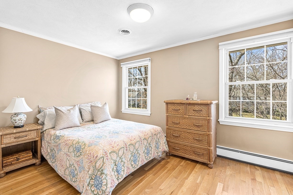 24 Cider Mill Road Framingham, MA 01701 - Photo 16 of 19 a bedroom with a bed and a dresser