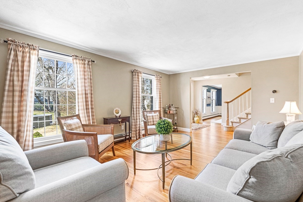24 Cider Mill Road Framingham, MA 01701 - Photo 3 of 19 a living room with furniture and a large window
