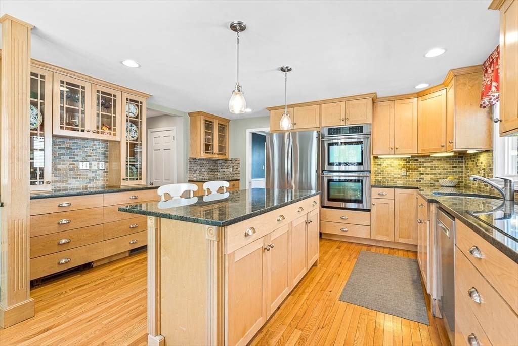 24 Cider Mill Road Framingham, MA 01701 - Photo 5 of 19 a kitchen with stainless steel appliances granite countertop a stove and a sink