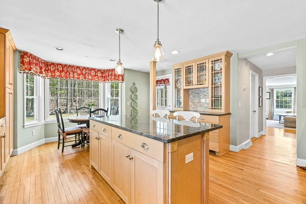 24 Cider Mill Road Framingham, MA 01701 - Photo 7 of 19 a very nice looking living room with wooden floor and furniture