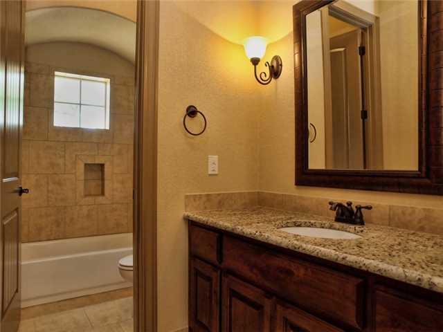 104 Vista Lane Georgetown, TX 78633 - Photo 23 of 36 This Bathroom serves both bedrooms three and four. Each has a private vanity space.