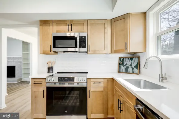 a kitchen with a stove and a sink
