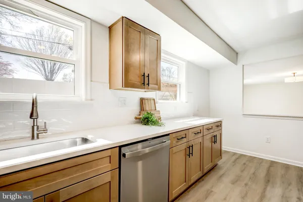 a kitchen with a sink and a window