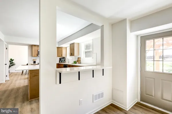 a view of kitchen with wooden floor