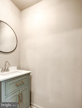 a bathroom with a sink and mirror